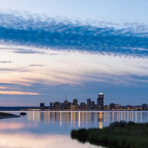 Winnipeg skyline at dusk across the river
